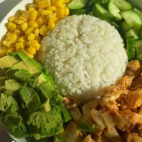 Chicken burrito bowl with rice corn avocado and black beans