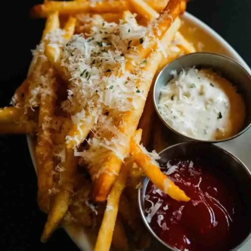 Loaded Voodoo fries served with cheese sauce and ranch dip