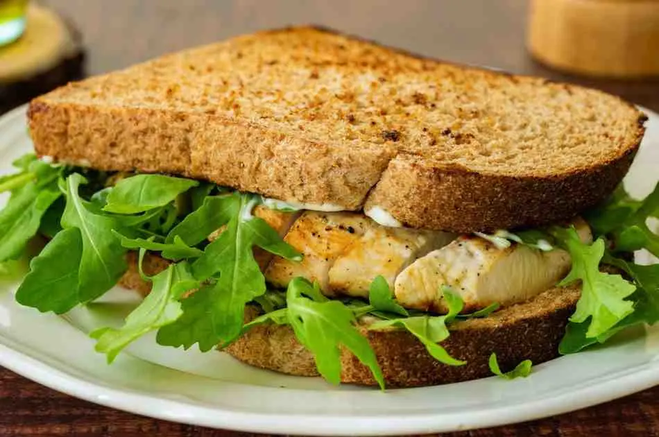 Assembled chicken avocado sandwich on toasted bread