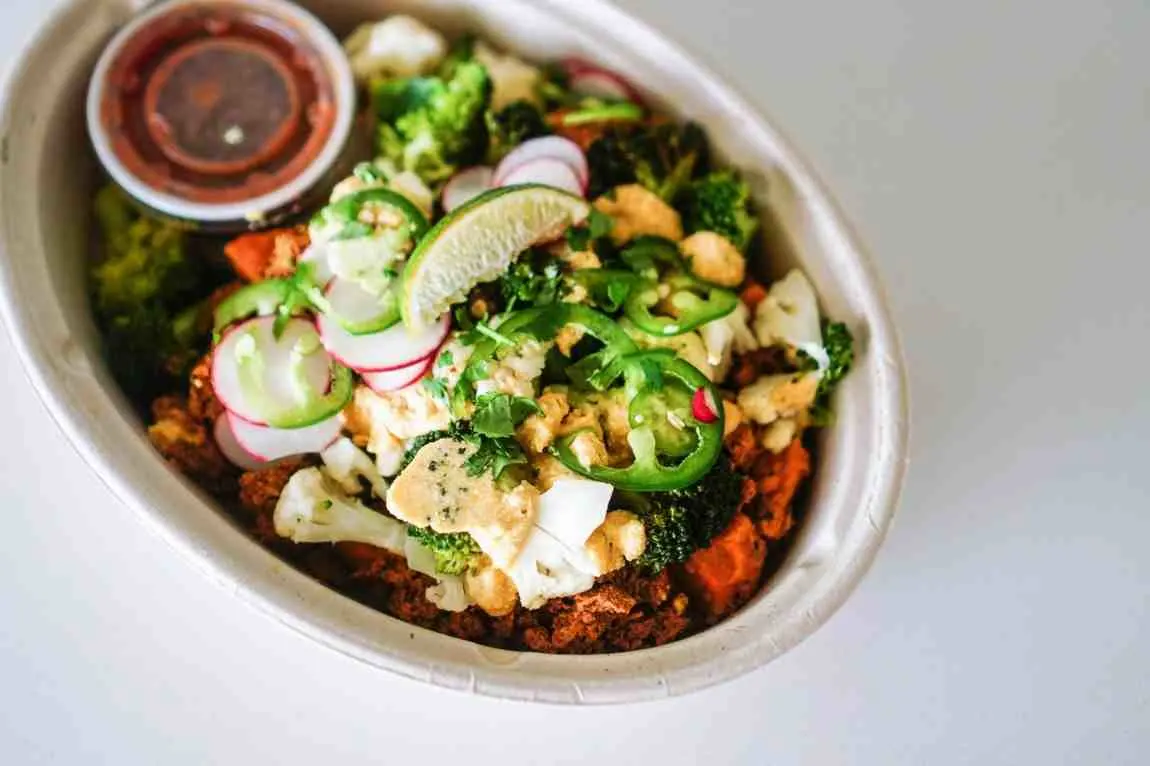 Fresh southwest breakfast bowl ingredients with jalapeños cilantro and lime