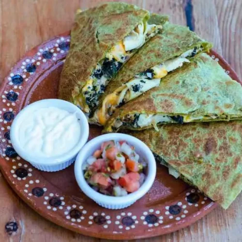 Mediterranean quesadillas with spinach, feta, mozzarella, and red onion