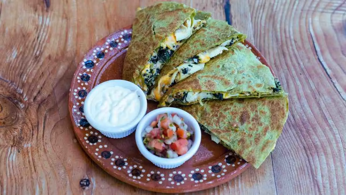 Mediterranean quesadillas with spinach, feta, mozzarella, and red onion