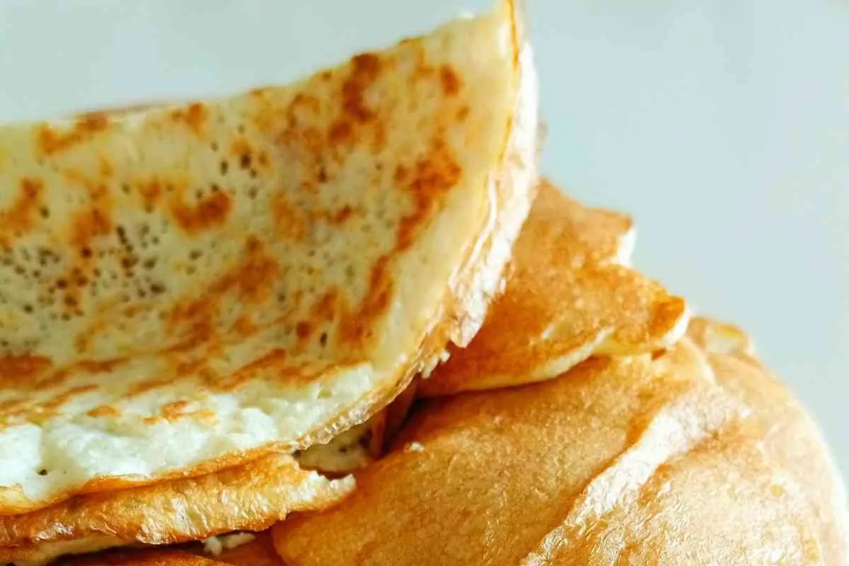 Freshly cooked soft fluffy pancakes ready for folding into breakfast tacos
