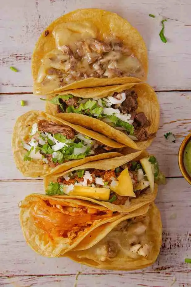 Homemade crockpot pineapple chicken tacos ready to serve