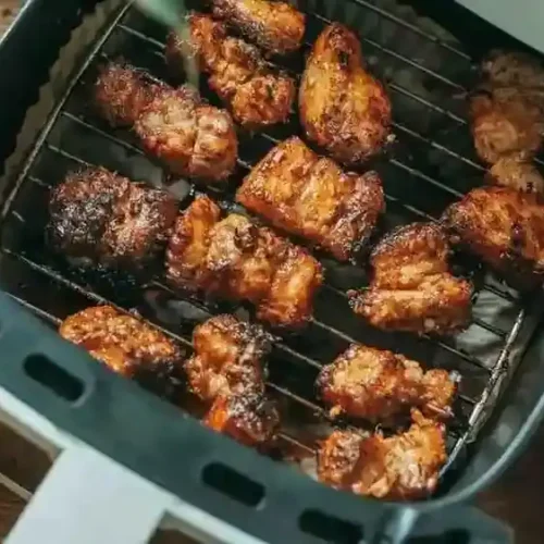 Cooking Sabatino's smoked mozzarella chicken sausages in air fryer basket