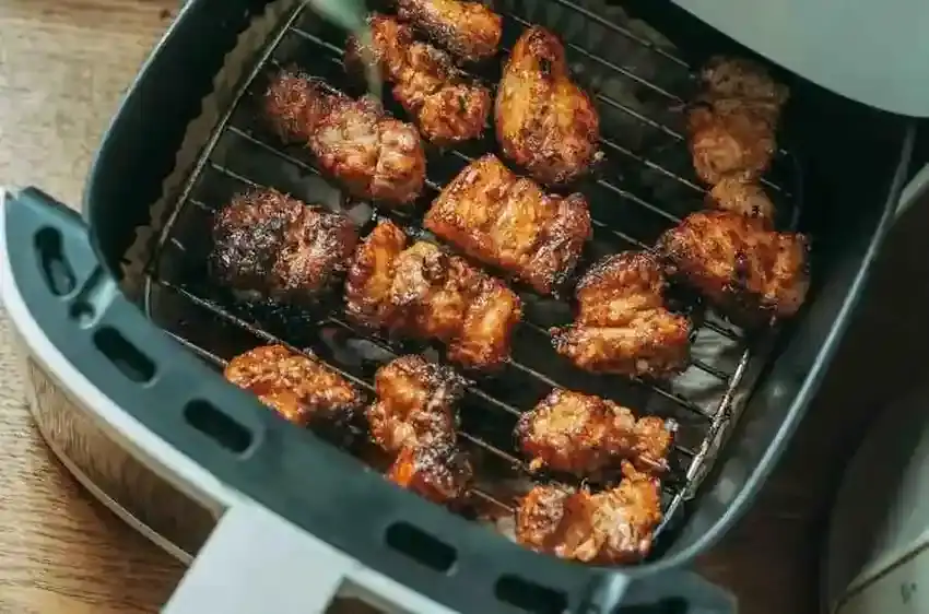 Cooking Sabatino's smoked mozzarella chicken sausages in air fryer basket