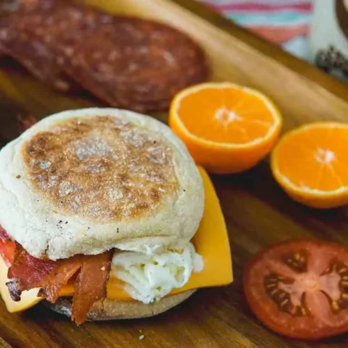 English muffin breakfast sandwich with egg cheese and sausage