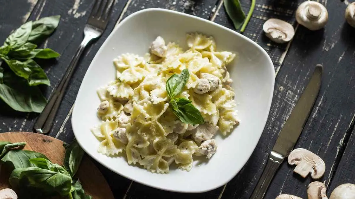 Creamy parmesan garlic beef bowtie pasta served in a plate