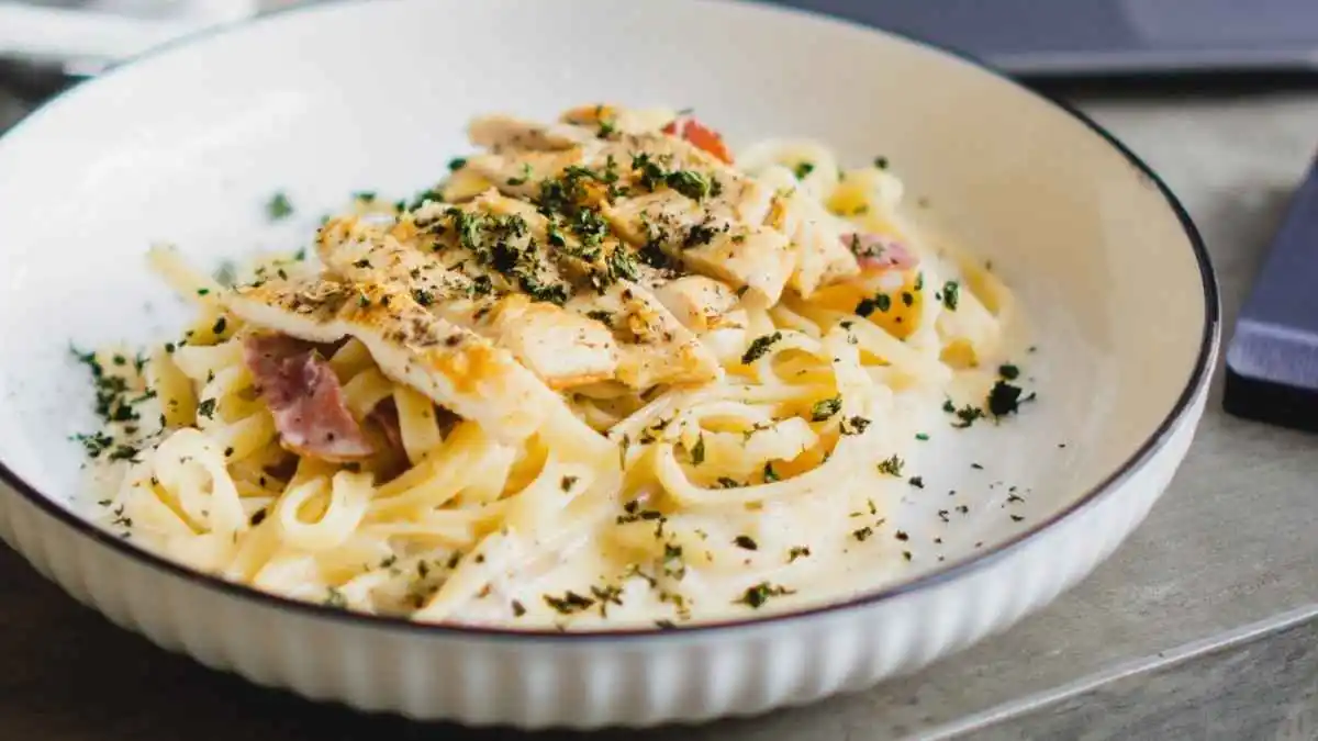 Creamy keto chicken alfredo served with zucchini noodles in a bowl