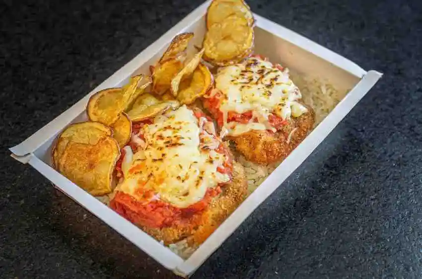 Crispy keto chicken parmesan freshly cooked in an air fryer tray